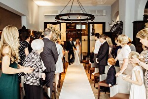 Intimate indoor ceremony set-up, approx. 30 guests.